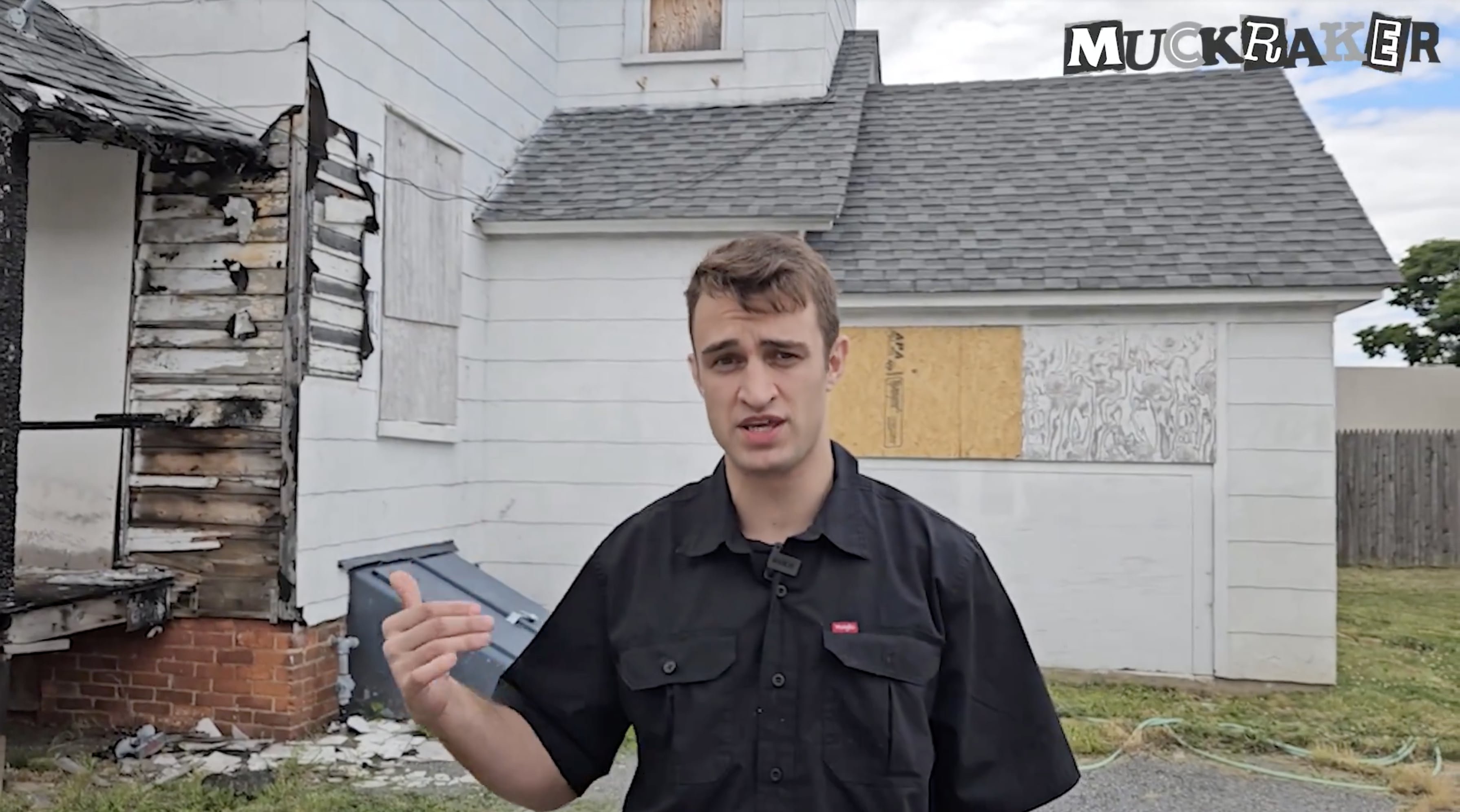 Anthony Rubin in front of an abandoned house