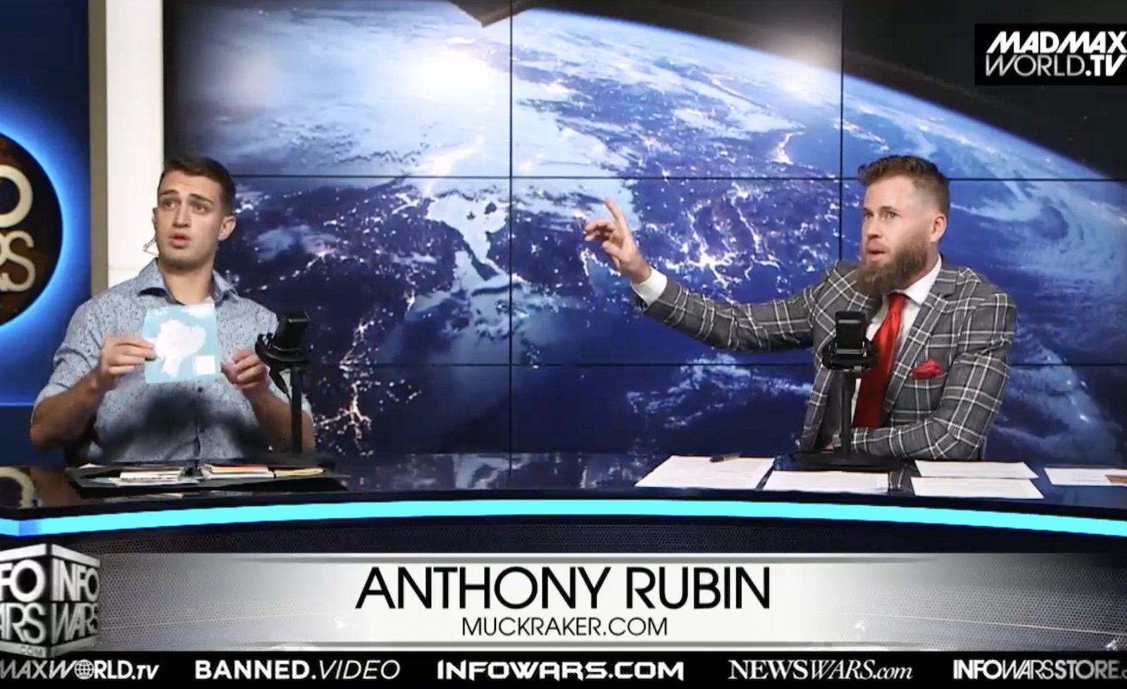 A photo of Owen Shroyer interviewing Anthony Rubin while Anthony Rubin holds a map of Ecuador